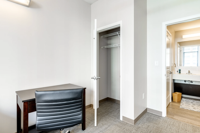 Other side of bedroom showing entrance and closet - Nine East 33rd Apartments
