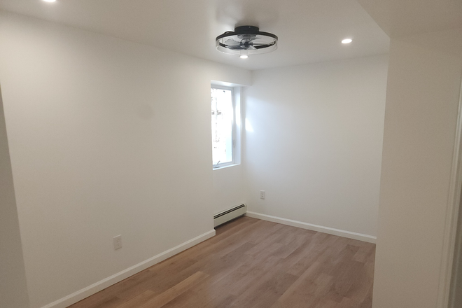 Bedroom - Newly Renovated 1BR Apartment in Rocky Point Private Yard & In-Unit Laundry!