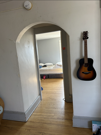 Living room looking into large bedroom - 2 Bedroom Apartment