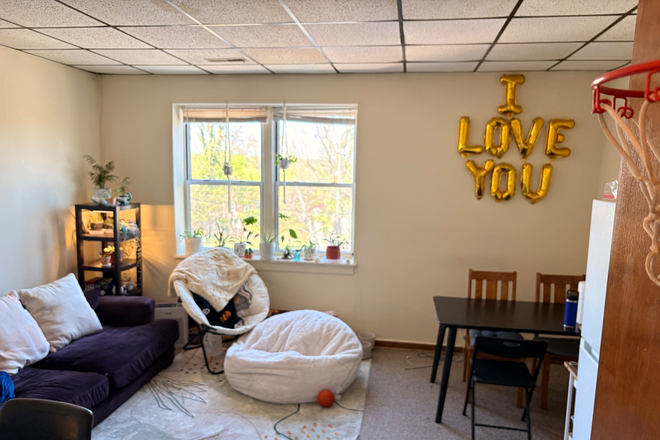 Living Room with Refrigerator - 2 Bdrm Apartment on West Main St