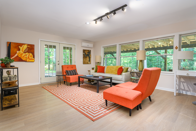 Light & Brioght Living Room with wrap around windows & french Door - Magical furnished 1BR Renovated home In The Trees with parking - In Ivy