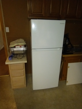 Personal Refrigerator in laundry room - Quiet One Bedroom Apartment
