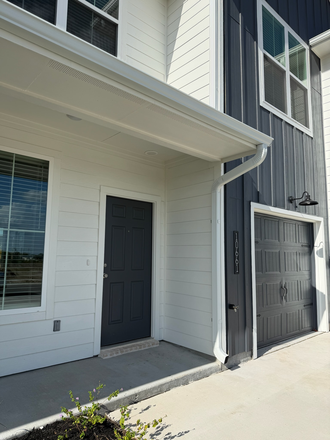 Front door and garage - Brand New 3BR Townhome College Station