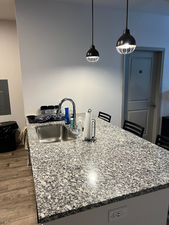 Kitchen bar / a bedroom door - The Beacon Apartments