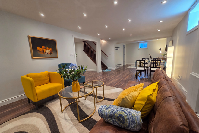Open concept living room which includes dining and study space - Clean & Private Furnished 1-BR Bsmt Suite near UTM (🐕 OK. All Utilities & Wi-Fi Inc. In-suite Ldry.)