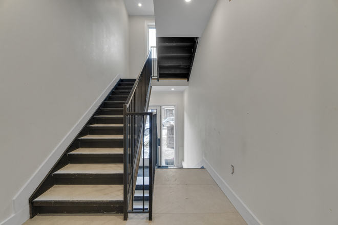 Interior common stairwell - Brand New 3 bed, 2 bath, 1000+ square foot multiplex unit Apartments