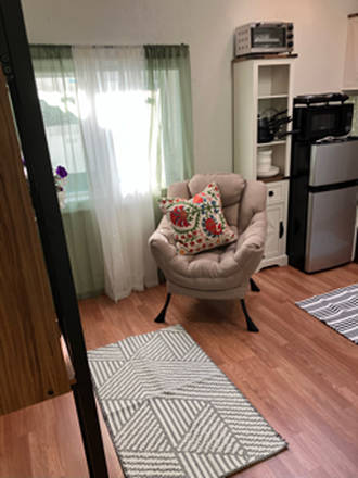 One side of sitting area - Adorable furnished cottage. Short walk or bike to Cal. Great neighborhood.