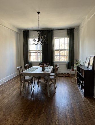 Dining Room - Furnished w/ Utilities Light-Filled Condo in Historic and Walkable Roland Park