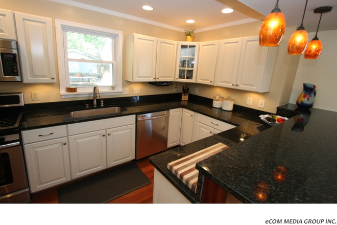 Kitchen with eat-in bar. - Spacious and Beautiful Home Close to Campus with Fenced in Backyard
