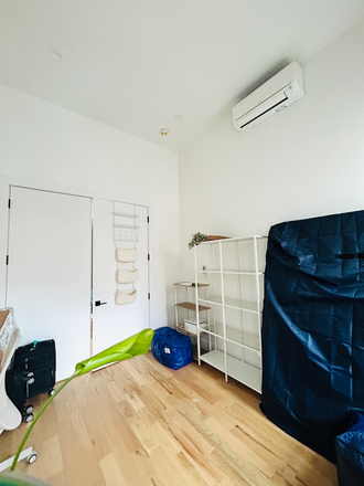 Bedroom with closed doors, AC visible - Sunny Large Bedroom for rent in furnished 4b2ba, near J line in Bushwick Duplex