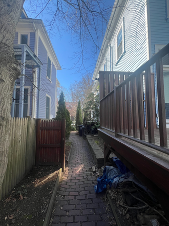 Walkway leading to back porch and studio entrance - Move-In Ready Studio with Lofted Bed & Utilities Included