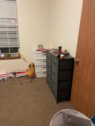 Bedroom. Please ignore the mess. - Apt 17, Granite Management