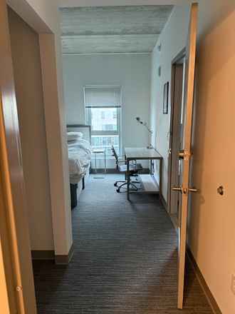 Bedroom view from bathroom - Vantage Apartments