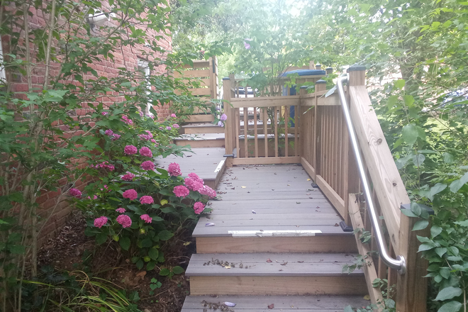Access from driveway to private entry - Complete Furnished Basement Apartment