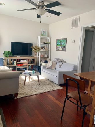 Cozy living room with natural light, ceiling fan, 1/2 bath, kitchen - Charming 1 Bed/1.5 baths, close to MUSC Apartments