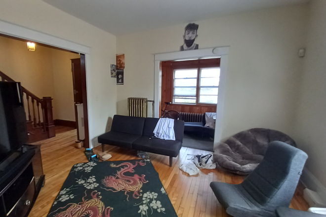 Living Room and Porch - January 1st 2026 to May 2027 Rental! 6 Bedrooms!  2 Blocks to Campus! House