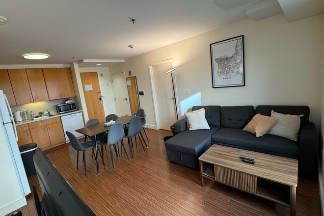 Living Room & Kitchen - 2-Bedroom, 2-Bathroom Sublease at One Western Avenue – 677 SF (All-Inclusive Utilities)