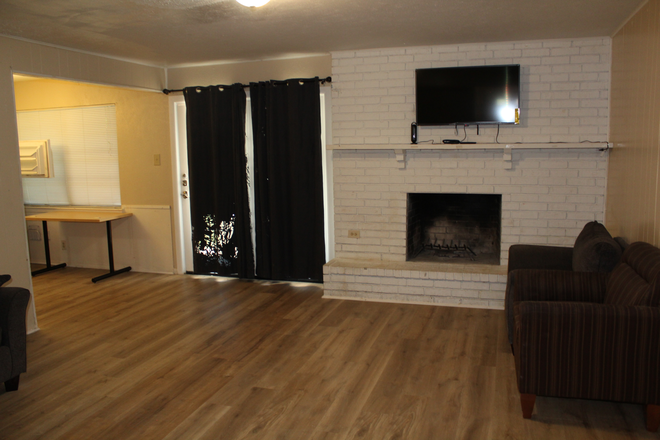 Living room with fireplace - House close to UTD. Renovated and waiting for new tenants