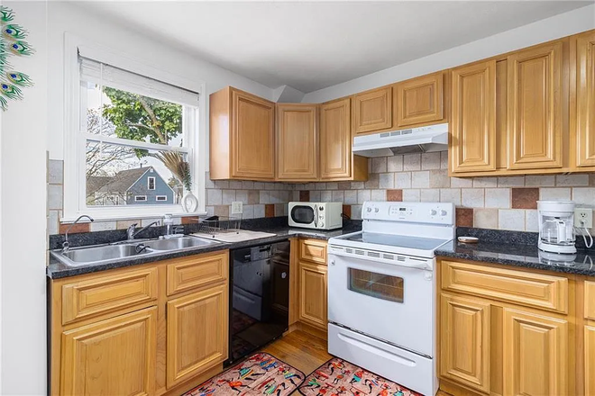 Kitchen - Furnished 4-Bedroom, 1 Mile from Campus | Private Parking | Water/Sewer Included | $3,200+ Apartments