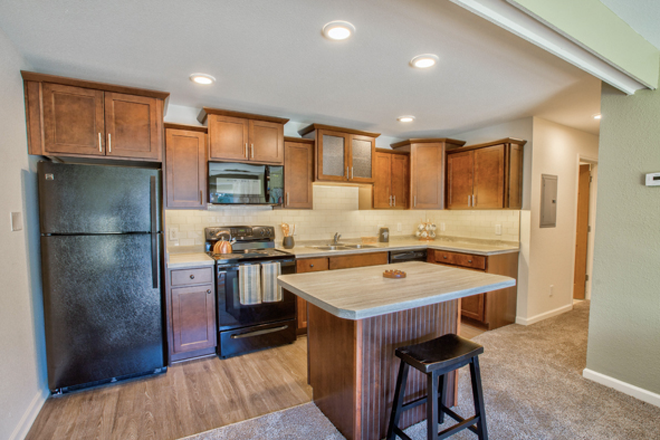 Not my room. My island is a little bigger with 2 stools and the room is inverse so the fridge is on the right side etc. - Cedar Village