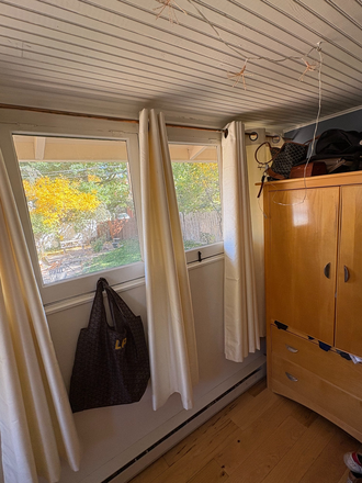 Bedroom with a wall of windows - Sublet available in a charming, three bedroom home on The Hill