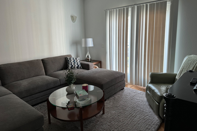 Livingroom with juliet door over looking the pool - Midtown Condomumium