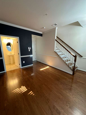lower level flex space, second living room with bathroom - Luxury New Construction + Private Garage - Steps from Johns Hopkins  Hospital Townhome