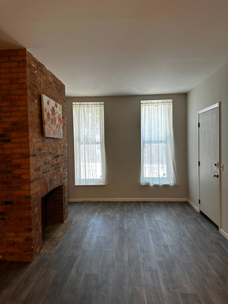 Entryway, living room, and fireplace - Large 1 Bedroom Apartment in Hollins Market