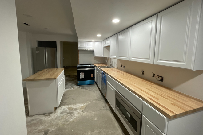 Kitchen, floor is being done this week. - Newly renovated modern 2-3 bedroom apartment New premium appliances AC 2 full baths Storage