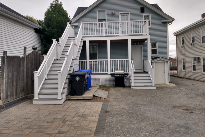 Back yard/patio - 124 Leo Ave North Providence RI 02904. Available now! $2,095/mo. Duplex