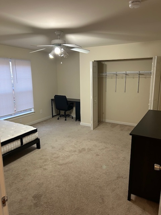 large bedroom furnished includes bed, desk, and dresser - Carrollton Terrace JPA