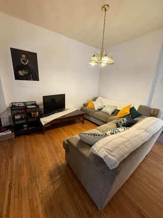 Living room and TV -> sofa, TV and furniture stays - Large sunny furnished rooms in a quiet air-conditioned home, short walk to U of T, private garden