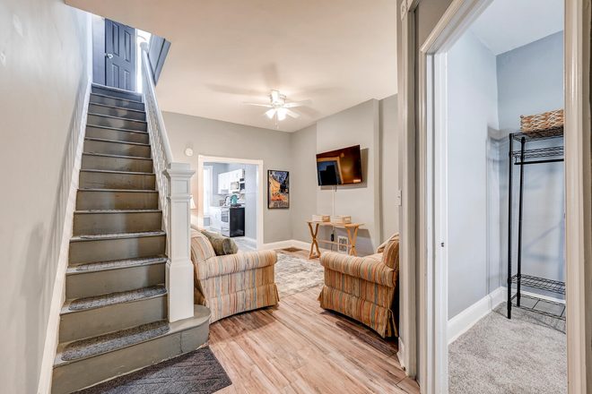 Living room, first floor bedroom - Share a beautifully rehabbed townhouse within walking distance to Homewood campus: