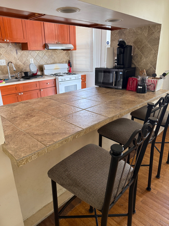 Breakfast bar overlooking kitchen - Live affordably, Walk to JHU: Private Room in Quiet 4 BR House