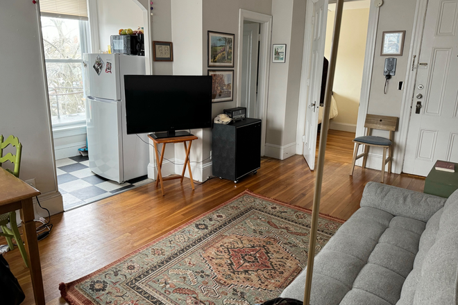 Living Room shown furnished - 1 Bedroom Apartment. 1 Block Walk to Brown. Heat and Hot Water Included.