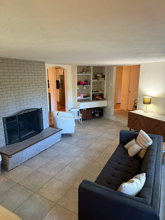 Living room with operable fireplace - Spacious 4 Bedrooms, 2 Bathroom Unit in a subdivided South Eugene Home