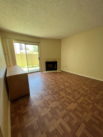 Living room view 1 (with sliding glass door to patio) - One bedroom condo close to Med Ctr, Rice U
