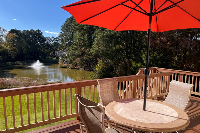 view from deck, kitchen and living room - Beautiful furnished home with serene lake view.  3 bdrm 2.5 bath w/ dedicated office-South point