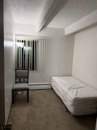 Private bedroom with window, bed frame and chair - Creekside Apartments - Furnished Private Room in 2BR/1BA, Lease Takeover Through May 2027