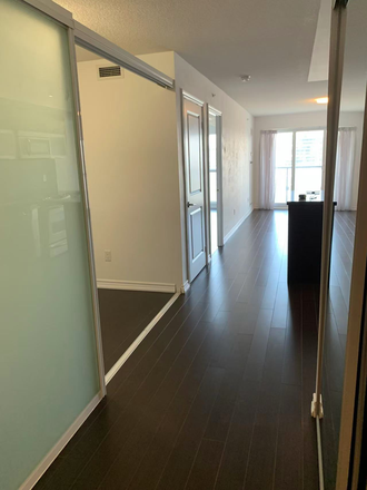 Hallway (leftward is the den entrance) - Aura Building Condo - Master Bedroom and Private Bathroom (with Kitchen and Laundry Machine)