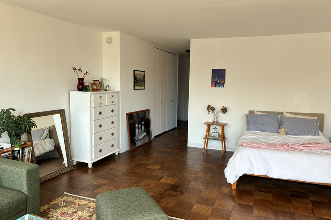 Alternate angle highlighting the flexible layout and generous living space. - Oversized High-Floor Studio Opposite NYU Langone | Doorman, Gym & Open Views Condo