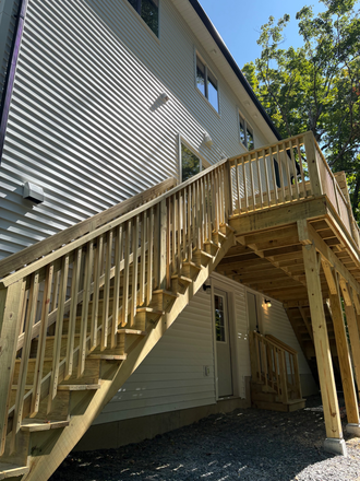 Back porch walk out basement - Beautiful, brand new construction at Cushman Village. Duplex