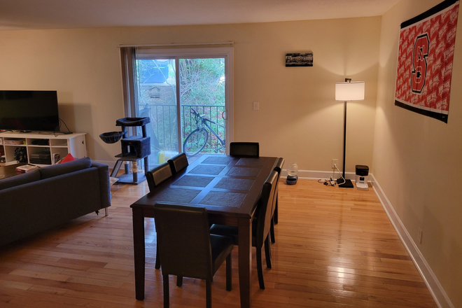 Living room, and balcony - Kensington Park Apartments