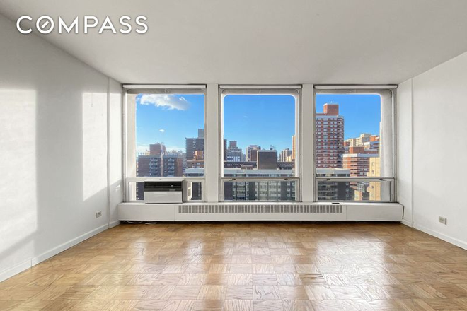 Main living area showcasing oversized windows and city views - Oversized High-Floor Studio Opposite NYU Langone | Doorman, Gym & Open Views Condo