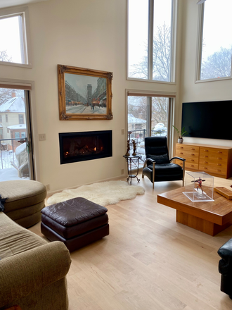Living room with large frame television. - Desnoyer House