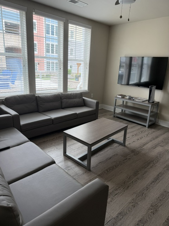 Common room - Oasis Apartments right by Liberty and CVCC! First 3 months paid!