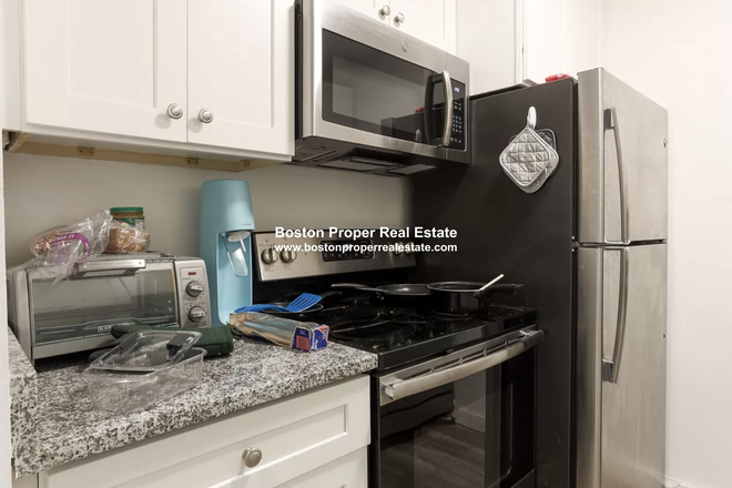 a - Right behind NEU, 2 bed with living room!