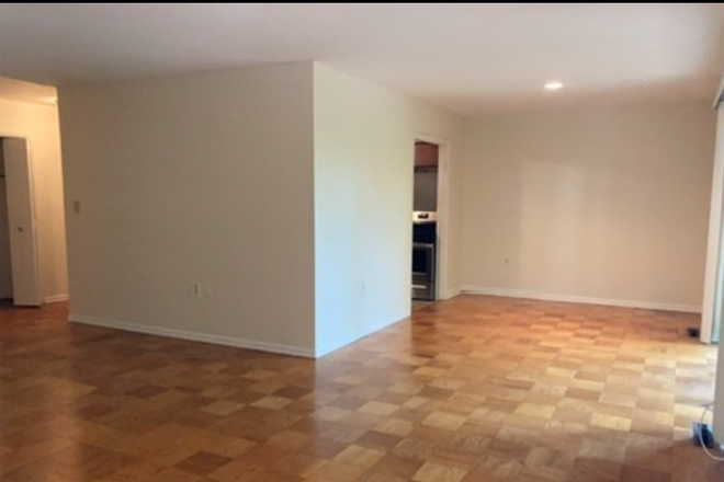 open living/dining without furniture - Spacious 1 Bdrm with Patio in Cross Keys Condo