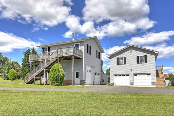 Exterior view - apartment is above the garage on the left - One Bedroom Country Apartment