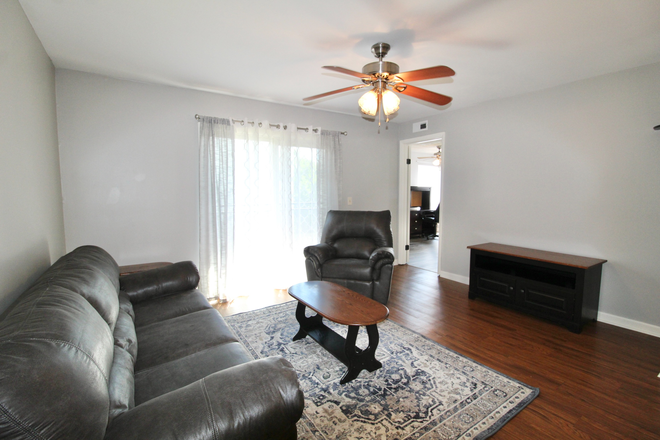 Living area - Looking for the perfect place to live near JMU? We've got you covered! 2 bed 2 bath condos!